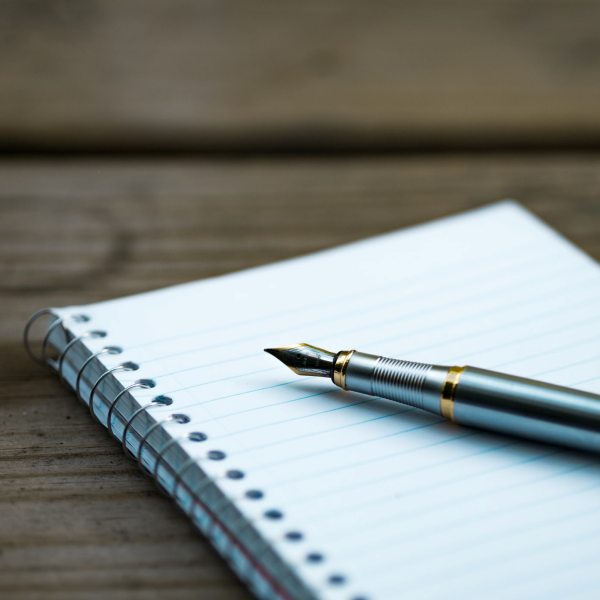 Image of a notebook and pen